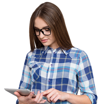 Smiling bearded man wearing glasses and a denim shirt holding and tapping a tablet device.